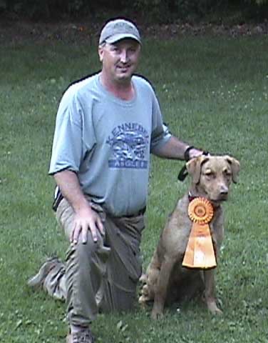 Heidi with her first Junior Hunter leg and her owner/handler Patrick.